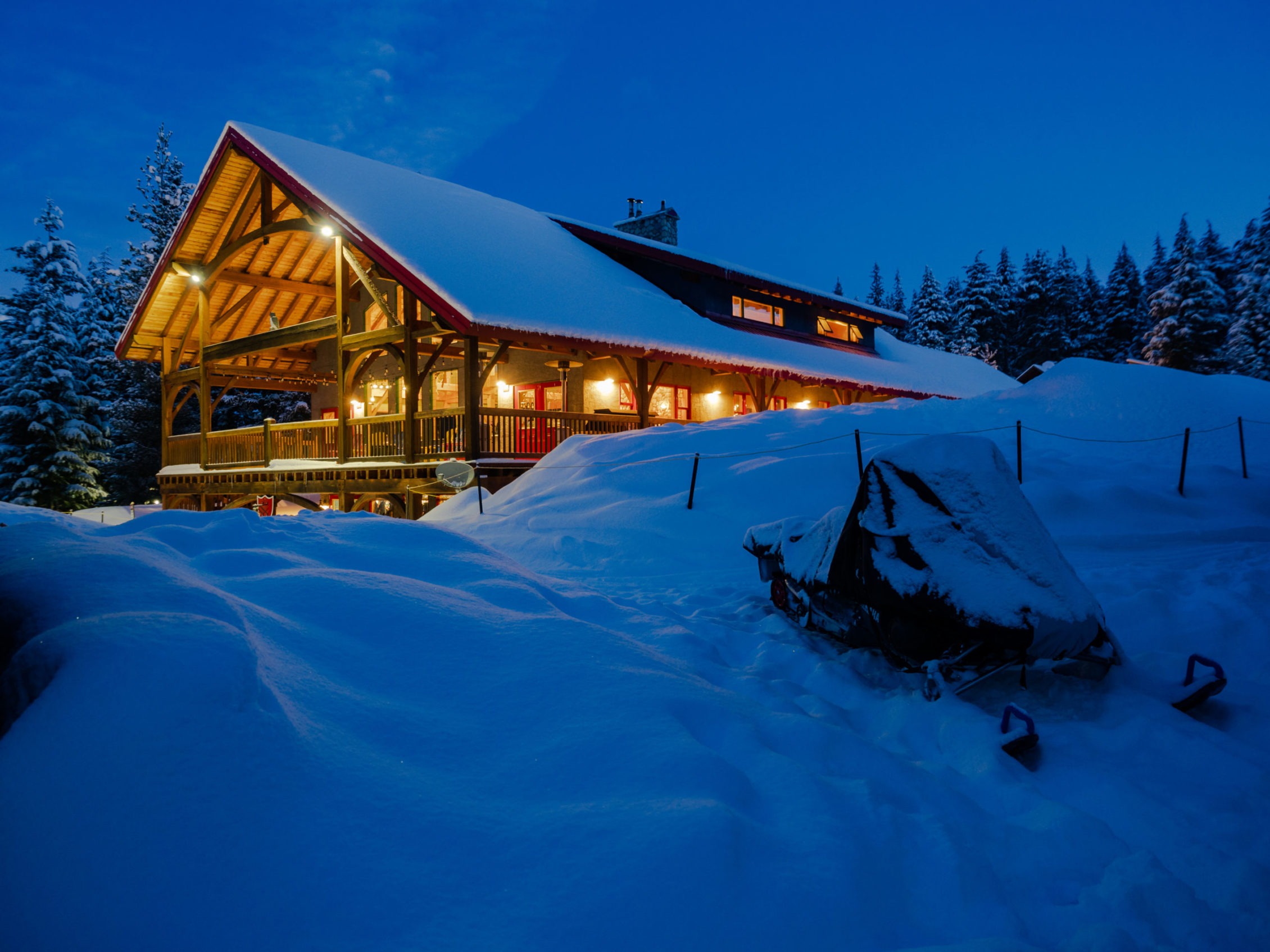 Snowy cabin at night