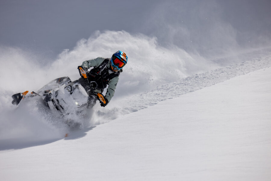 Dipping the skis into powder on a snowmobile.