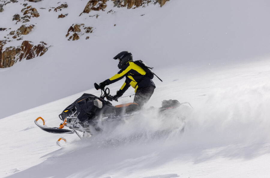 Snowmobiling in powder fields at Great Canadian and Heather Mountain Lodge in Golden, BC.